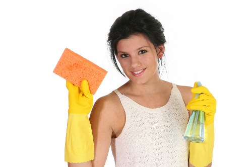 Technician performing deep mattress cleaning with equipment